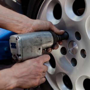 Image of mechanic removing a vehicle wheel