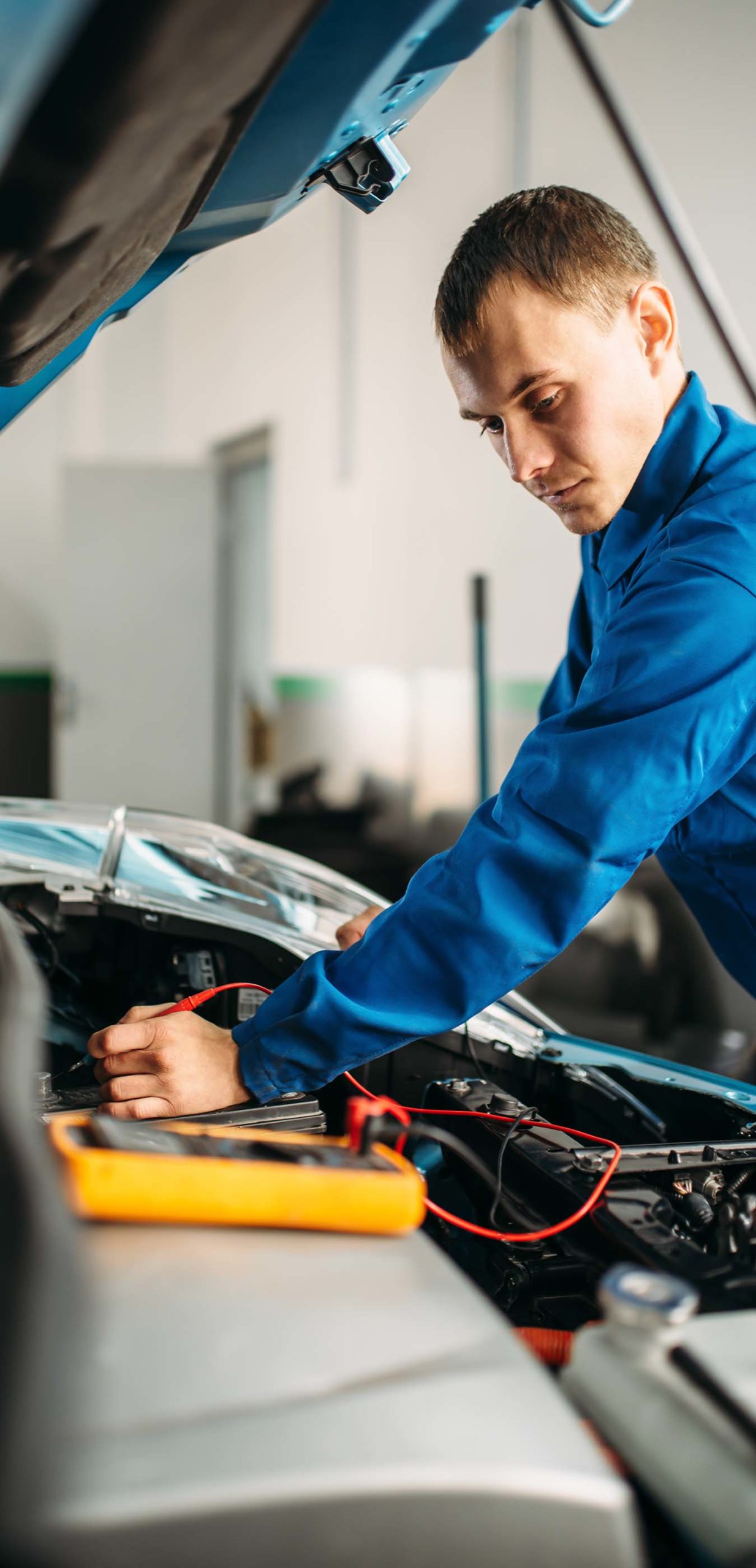 image of technician performing underhood diagnostics