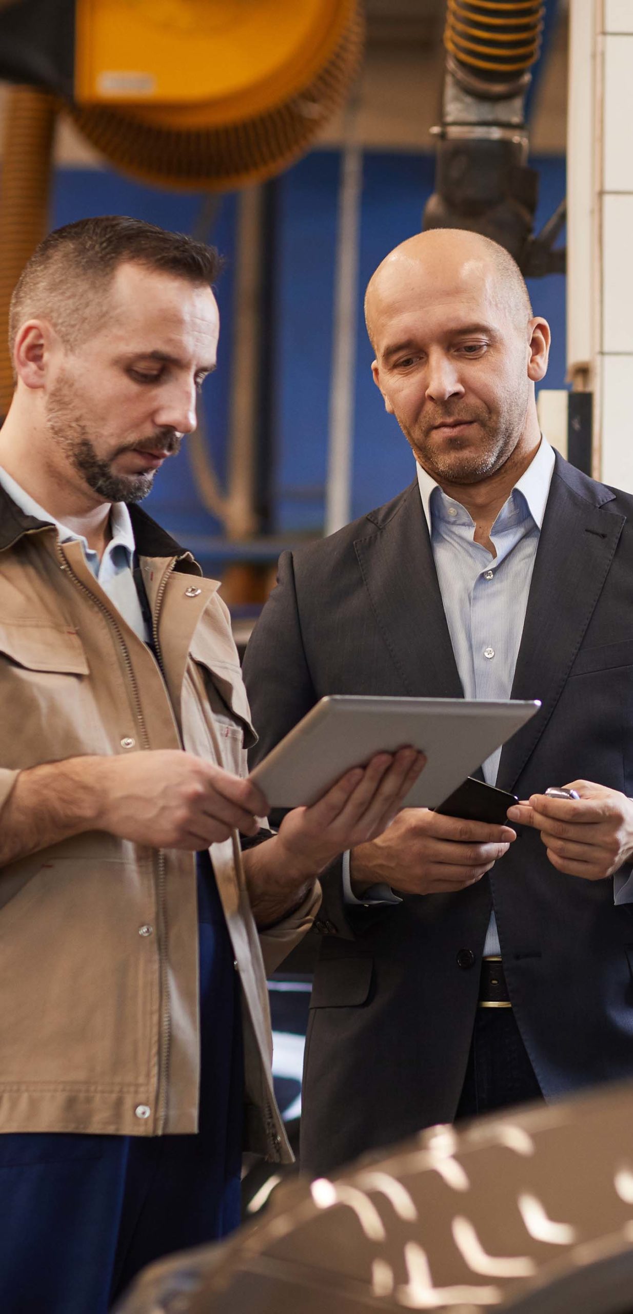 Image of service advisor presenting inspection findings to customer